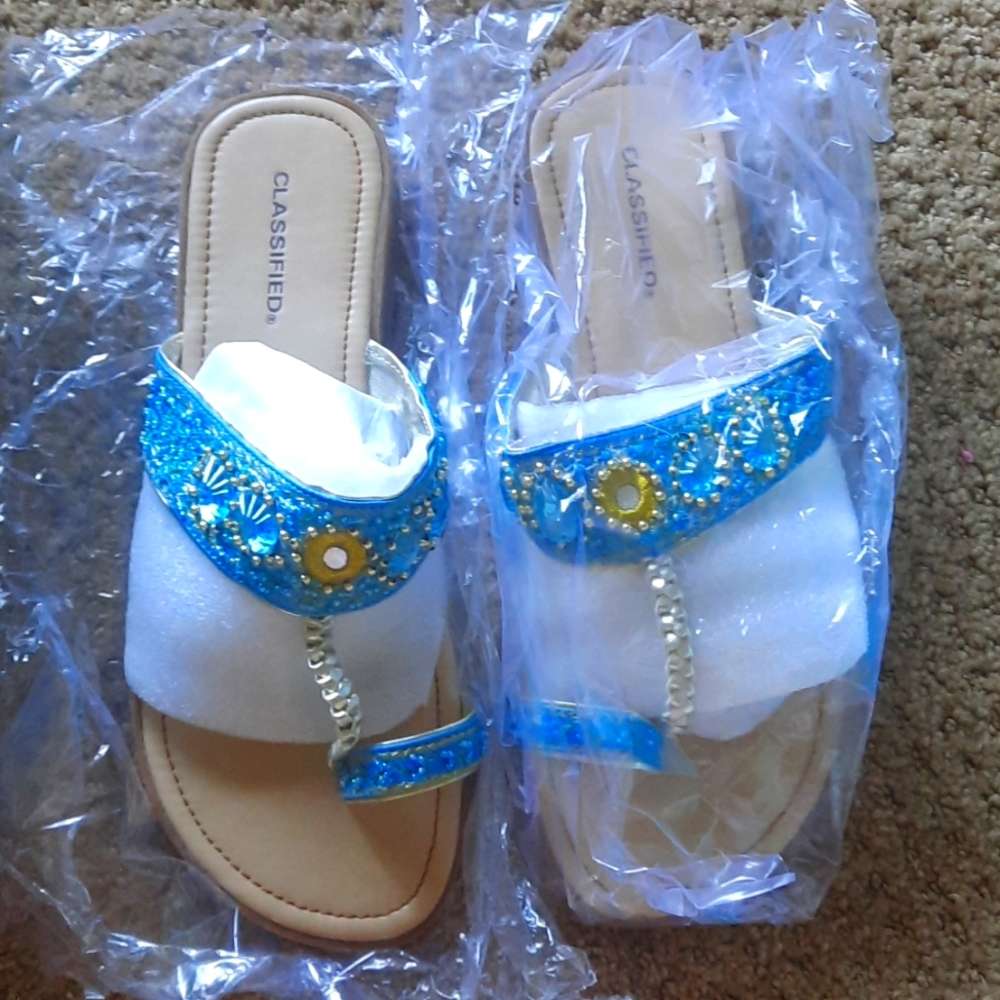 Classified turquoise bling bling sandals, brand new in original box.
